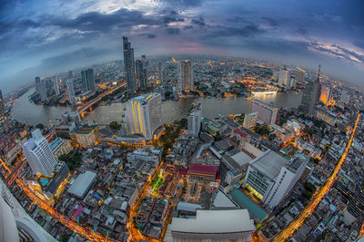 High angle view of illuminated buildings in city against sky