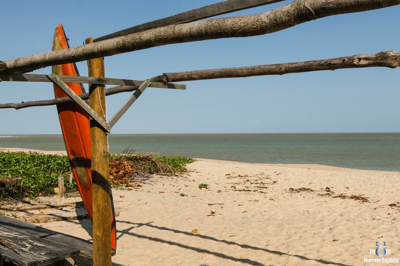 sea, water, no people, nature, scenics, day, tranquility, outdoors, tranquil scene, beauty in nature, beach, sky, wood - material, sunlight, horizon over water, clear sky, tree