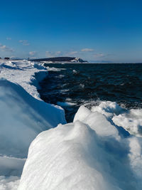 Scenic view of sea against sky during winter