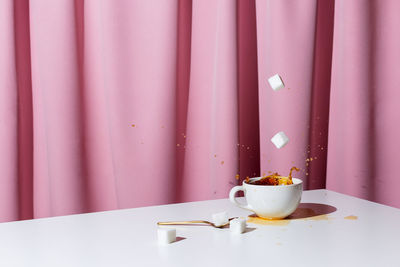 Close-up of coffee cup on table