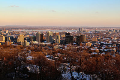 Cityscape against sky during sunset