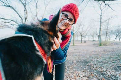 Portrait of young woman with dog