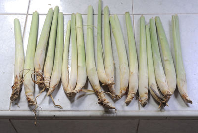 High angle view of lemon grass on tiles