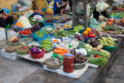 Colorful street market in hanoi. fruits, vegetables and other fresh goods. vietnam, asia