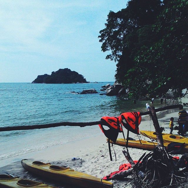 water, sea, beach, nautical vessel, tranquility, transportation, tranquil scene, beauty in nature, scenics, sky, mode of transport, nature, boat, shore, horizon over water, tree, mountain, sunlight, idyllic, travel