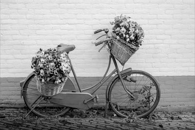 Bicycle parked against wall