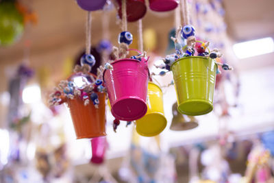 Close-up of multi colored hanging for sale in market