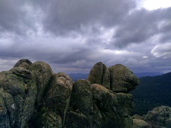 Rocks on mountain against sky