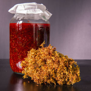 Close-up of orange flowers on table