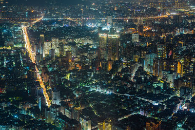 Aerial view of illuminated city at night