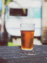 Close-up of beer glass on wooden table