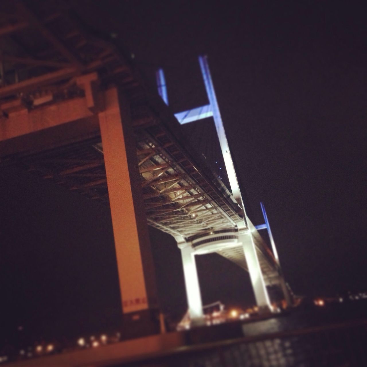 night, illuminated, low angle view, built structure, architecture, dark, bridge - man made structure, building exterior, clear sky, sky, transportation, connection, no people, outdoors, copy space, engineering, light - natural phenomenon, lighting equipment, city, dusk