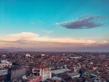 High angle shot of townscape against sky at sunset
