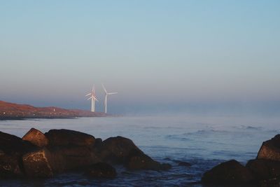 Scenic view of sea against clear sky during sunset