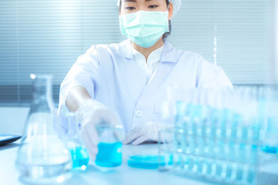 Scientist working at table in laboratory