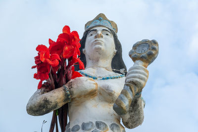 Low angle view of statue against sky