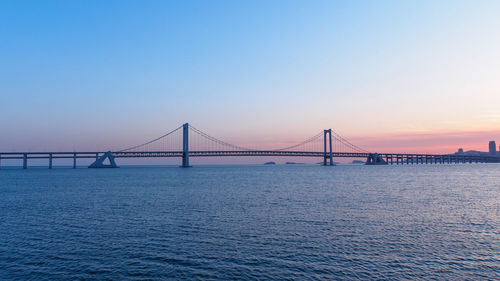 View of suspension bridge over sea