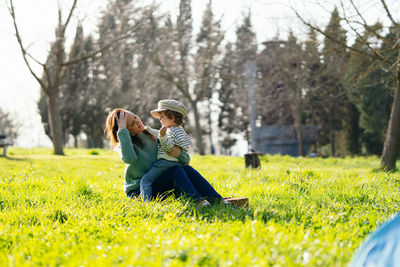 Rear view of couple on field