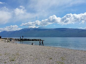 Scenic view of lake against cloudy sky