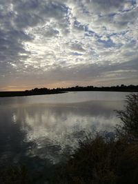 Scenic view of lake against sky during sunset