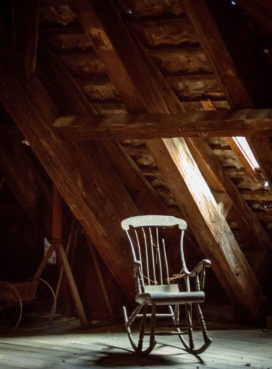 wood, floor, light, chair, seat, architecture, no people, indoors, darkness, night, lighting, absence, hardwood, room, furniture, built structure, house, building, interior design, flooring, empty, abandoned, old, home
