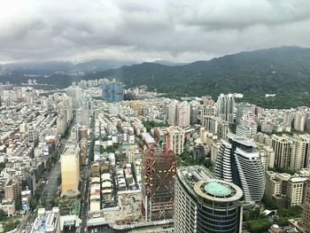 High angle view of modern buildings in city against sky