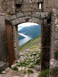 Bridge over river against wall