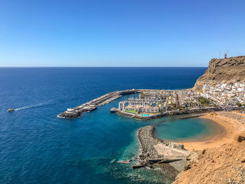 Scenic view of sea against clear blue sky