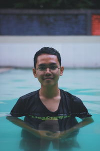 Portrait of young man in swimming pool