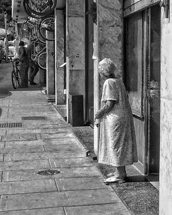 Rear view of people walking in temple
