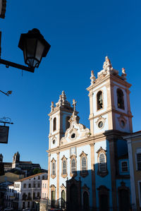 Low angle view of building against clear blue sky