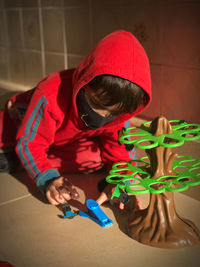 Low angle view of girl playing on floor at home