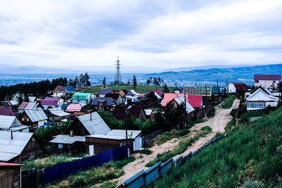 High angle view of townscape by building against sky