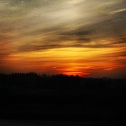 Scenic view of landscape against sky during sunset