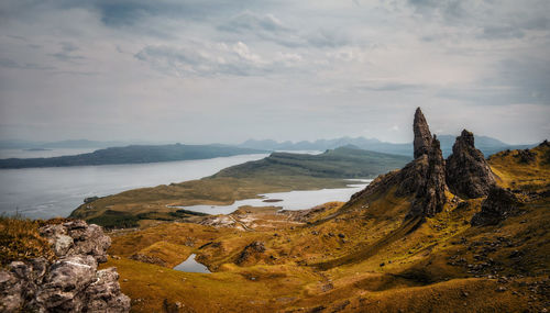 Panoramic view of sea and mountains against sky