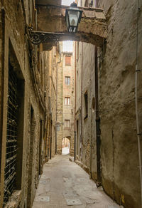Narrow alley amidst buildings