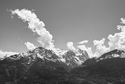 Low angle view of snowcapped mountain against sky