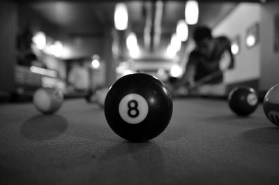 Close-up of pool ball on table