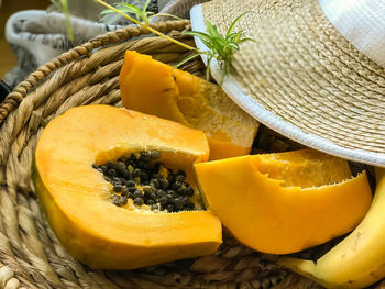 Close-up of fruits in basket on table