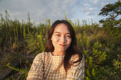 Portrait of young woman smiling