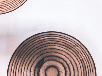 Low angle view of ceiling on table against white background