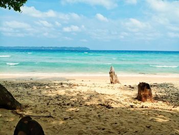 Scenic view of beach against sky