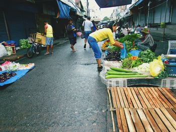 People at market stall