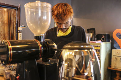 View of barista working in cafe