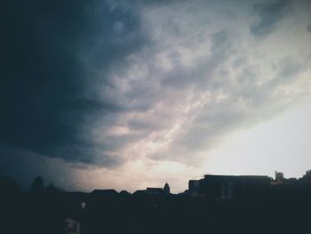 Low angle view of built structure against cloudy sky