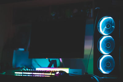 Close-up of illuminated lighting equipment on table