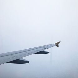 Low angle view of airplane flying in sky