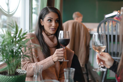 Friends toasting wineglasses in restaurant