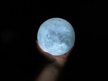 Close-up of hand holding moon