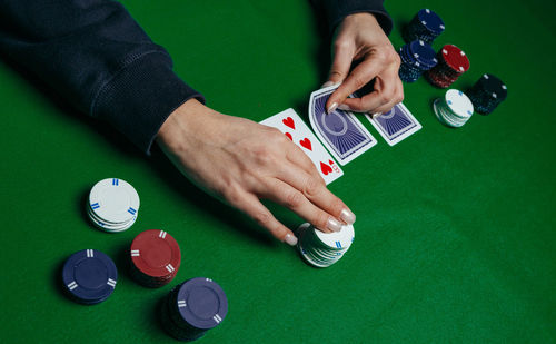 High angle view of hands playing piano